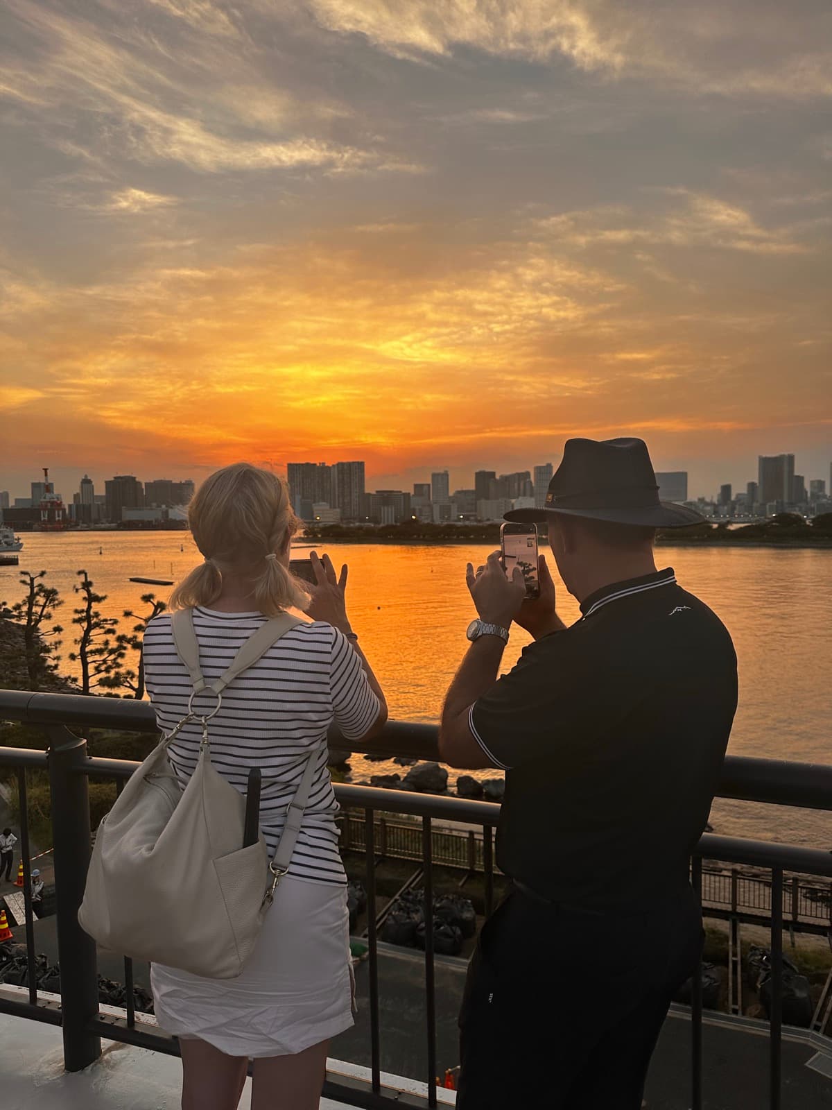 Guests watching the sunset over Tokyo Bay in Odaiba