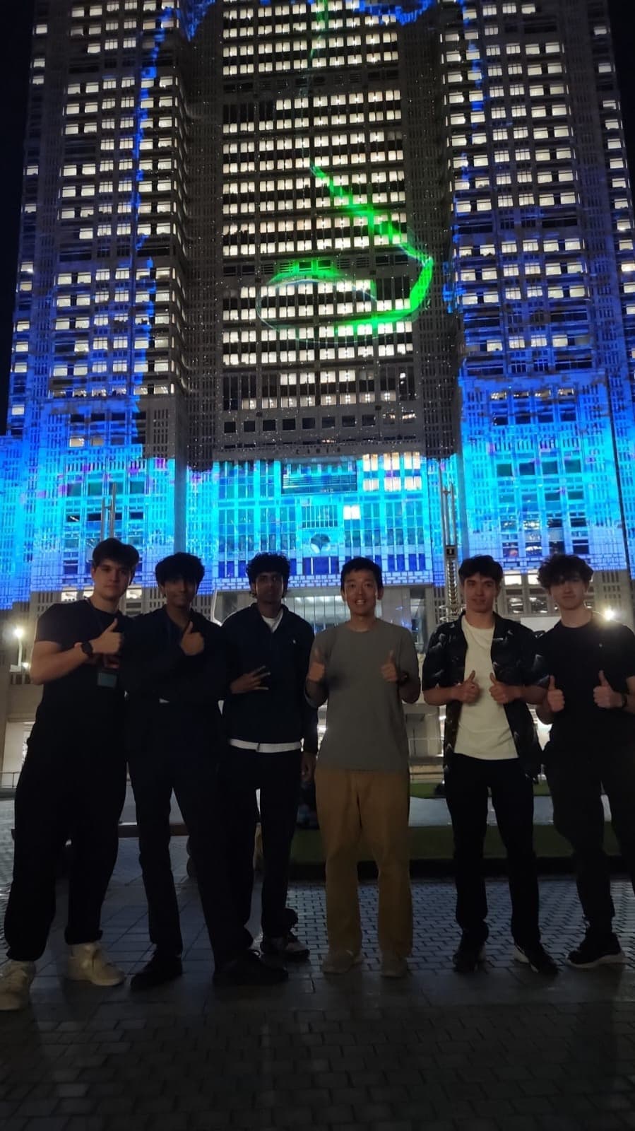 Guests in front of the illuminated Tokyo Metropolitan Government Building